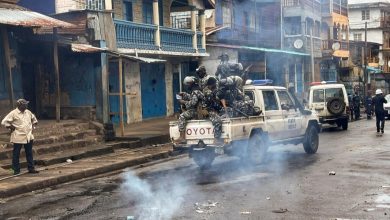 Image showing security personnel at a riot scene in Freetown Image Source: Aljazeera